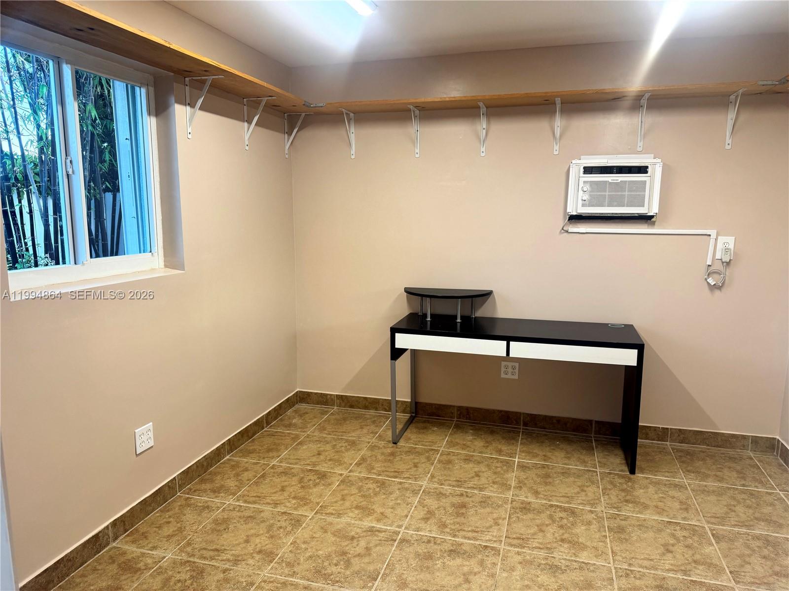 10760 Southwest 63rd Street Miami, FL 33173 - Photo 54 of 61 a bathroom with a bathtub and a shower