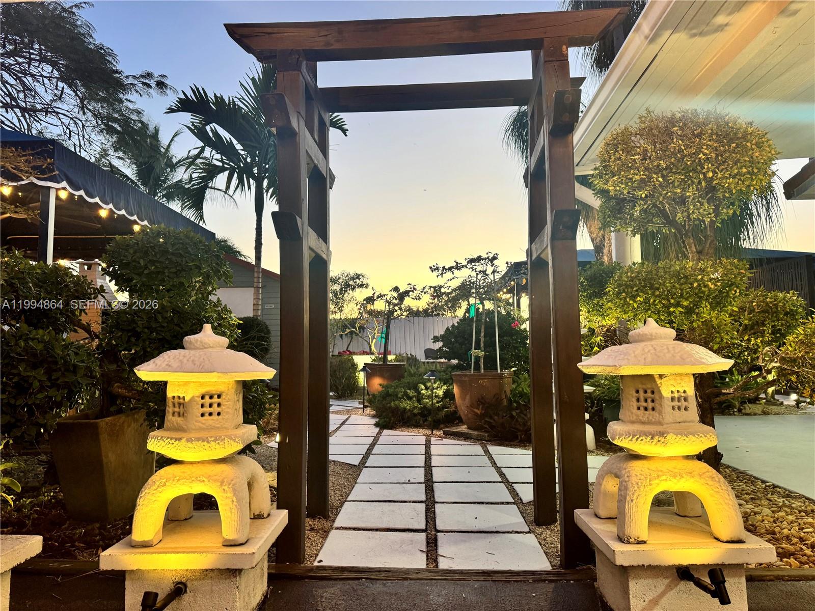 10760 Southwest 63rd Street Miami, FL 33173 - Photo 55 of 61 a view of swimming pool with a table and chairs