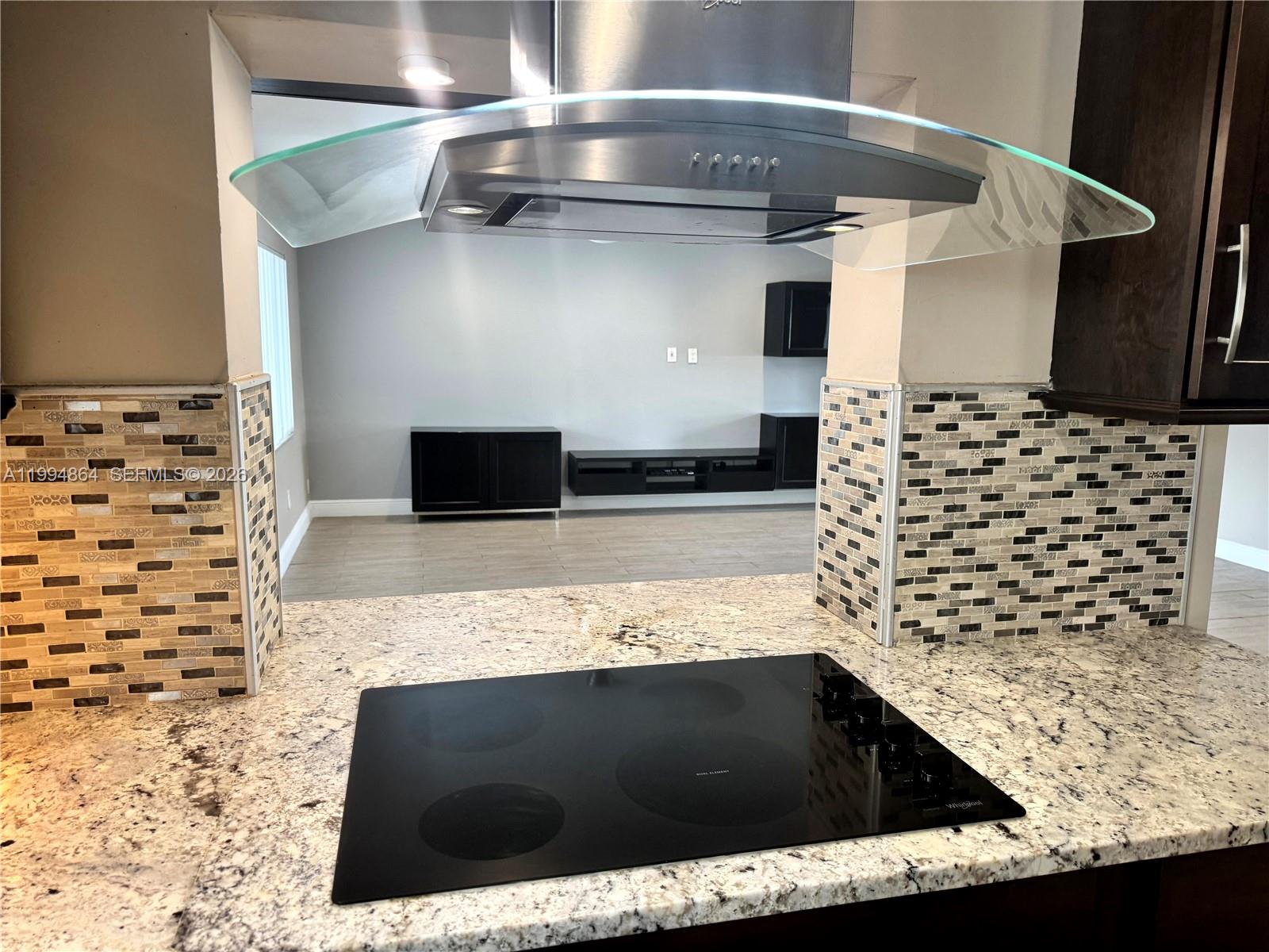 10760 Southwest 63rd Street Miami, FL 33173 - Photo 7 of 61 a kitchen with a stove and a shower