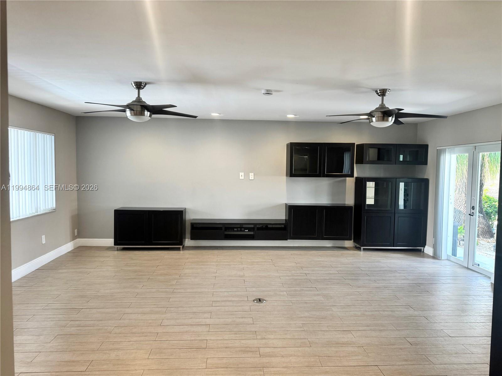 10760 Southwest 63rd Street Miami, FL 33173 - Photo 8 of 61 a view of a living room with kitchen