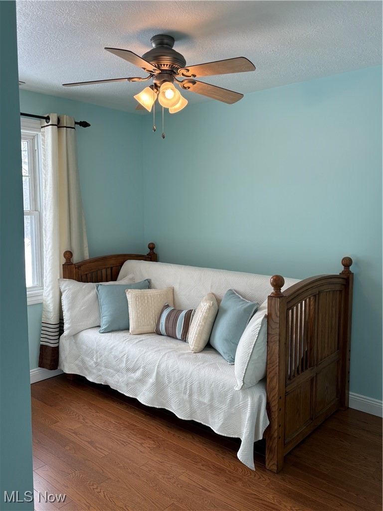 2504 Meloy Road Kent, OH 44240 - Photo 35 of 50 Bedroom featuring ceiling fan, Hard wood flooring, and a textured ceiling