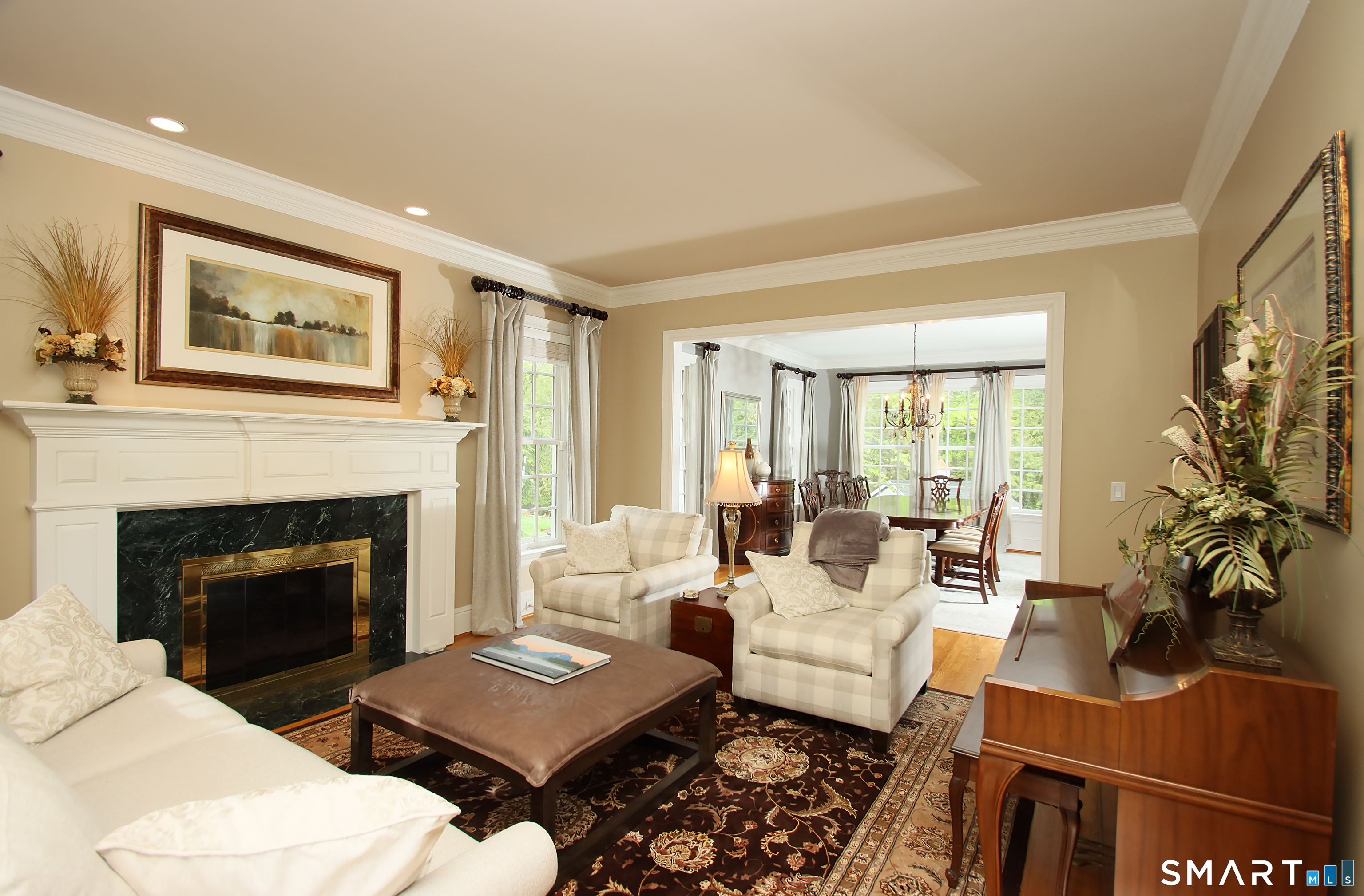 28 Quail Ridge Drive Avon, CT 06001 - Photo 15 of 40 a living room with furniture fireplace and a large window