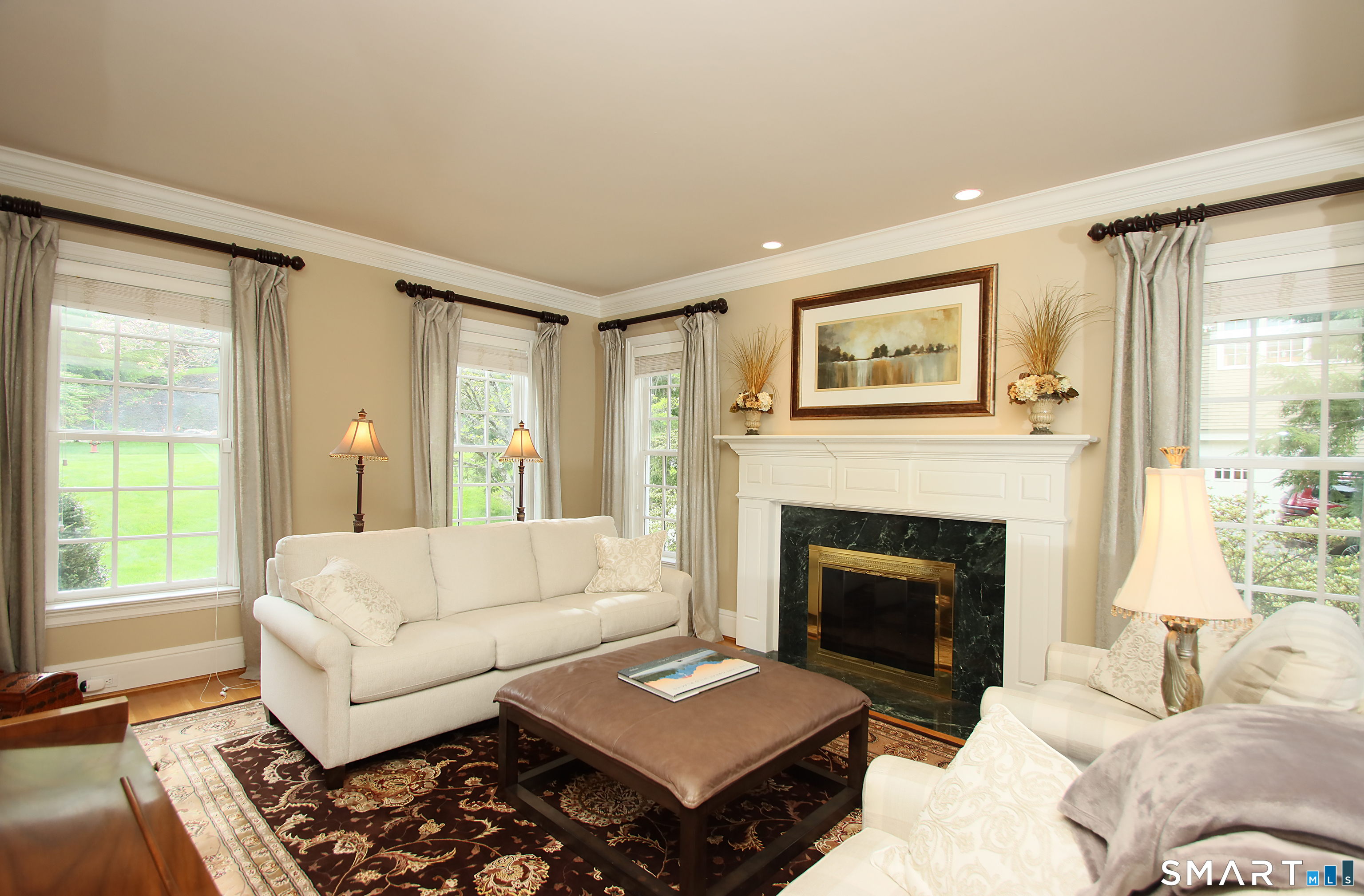 28 Quail Ridge Drive Avon, CT 06001 - Photo 17 of 40 a living room with furniture and a fireplace