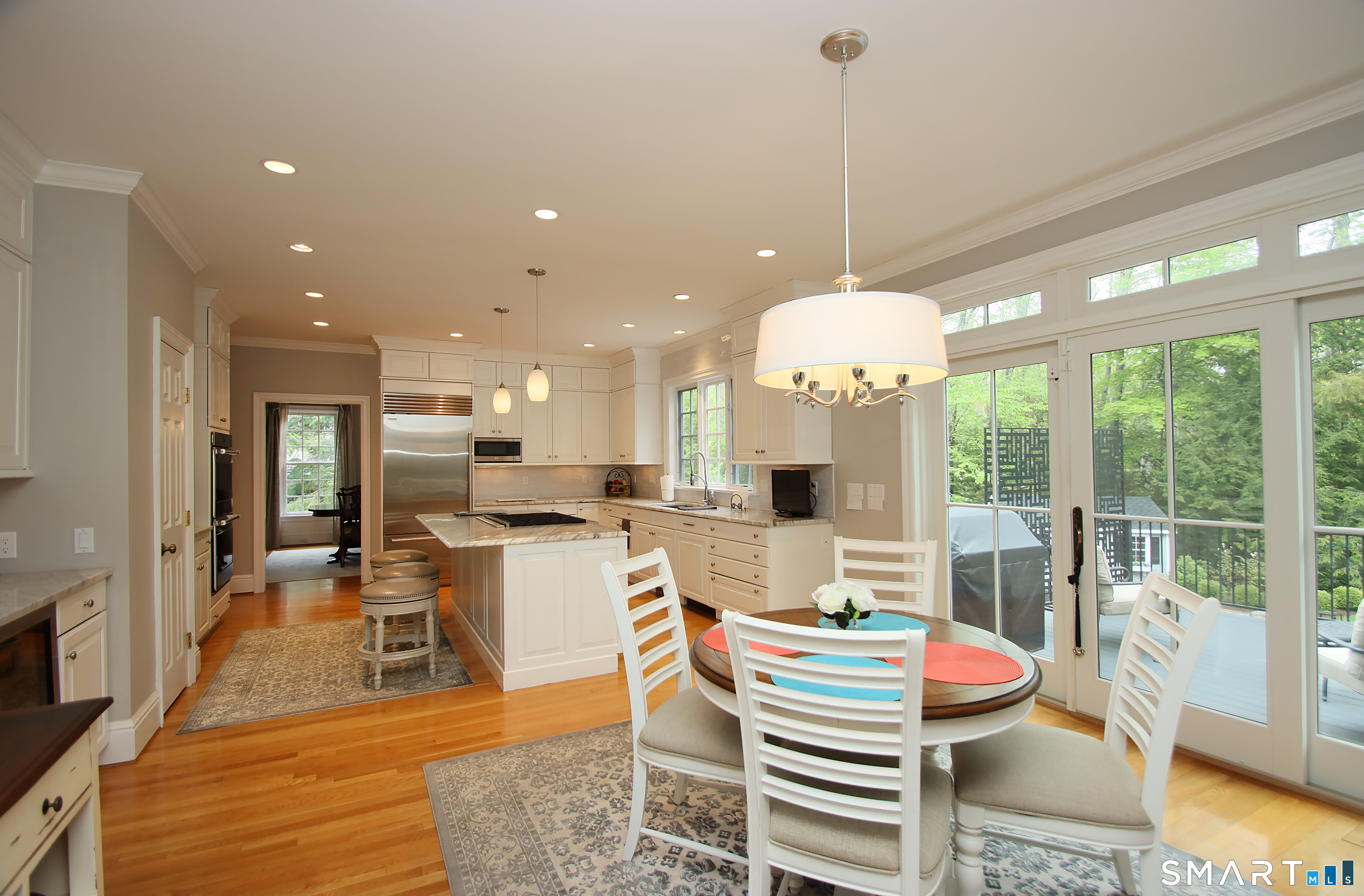 28 Quail Ridge Drive Avon, CT 06001 - Photo 20 of 40 a dining room with a table or chairs and a wooden floor