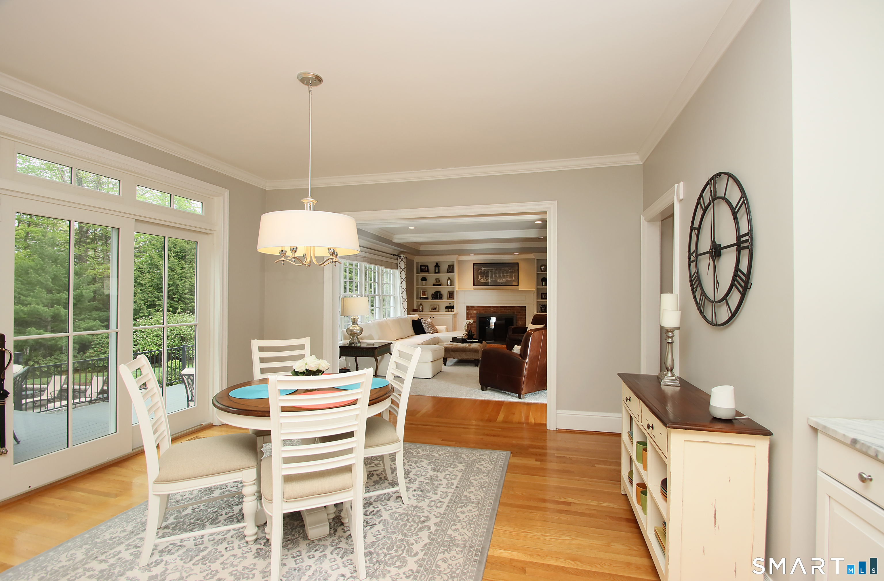 28 Quail Ridge Drive Avon, CT 06001 - Photo 23 of 40 a dining room with furniture a chandelier and wooden floor