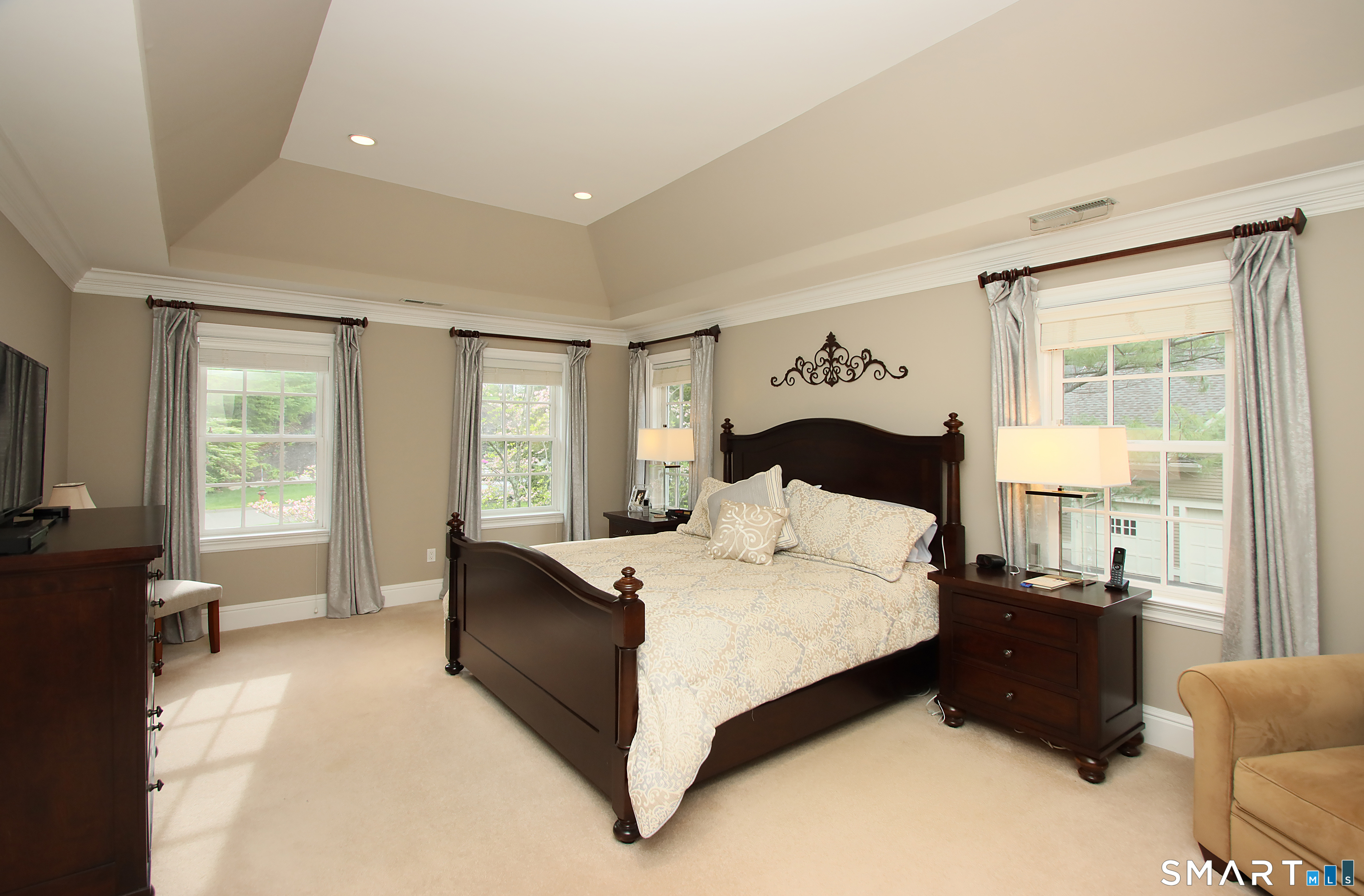 28 Quail Ridge Drive Avon, CT 06001 - Photo 28 of 40 a bedroom with a bed and a couch