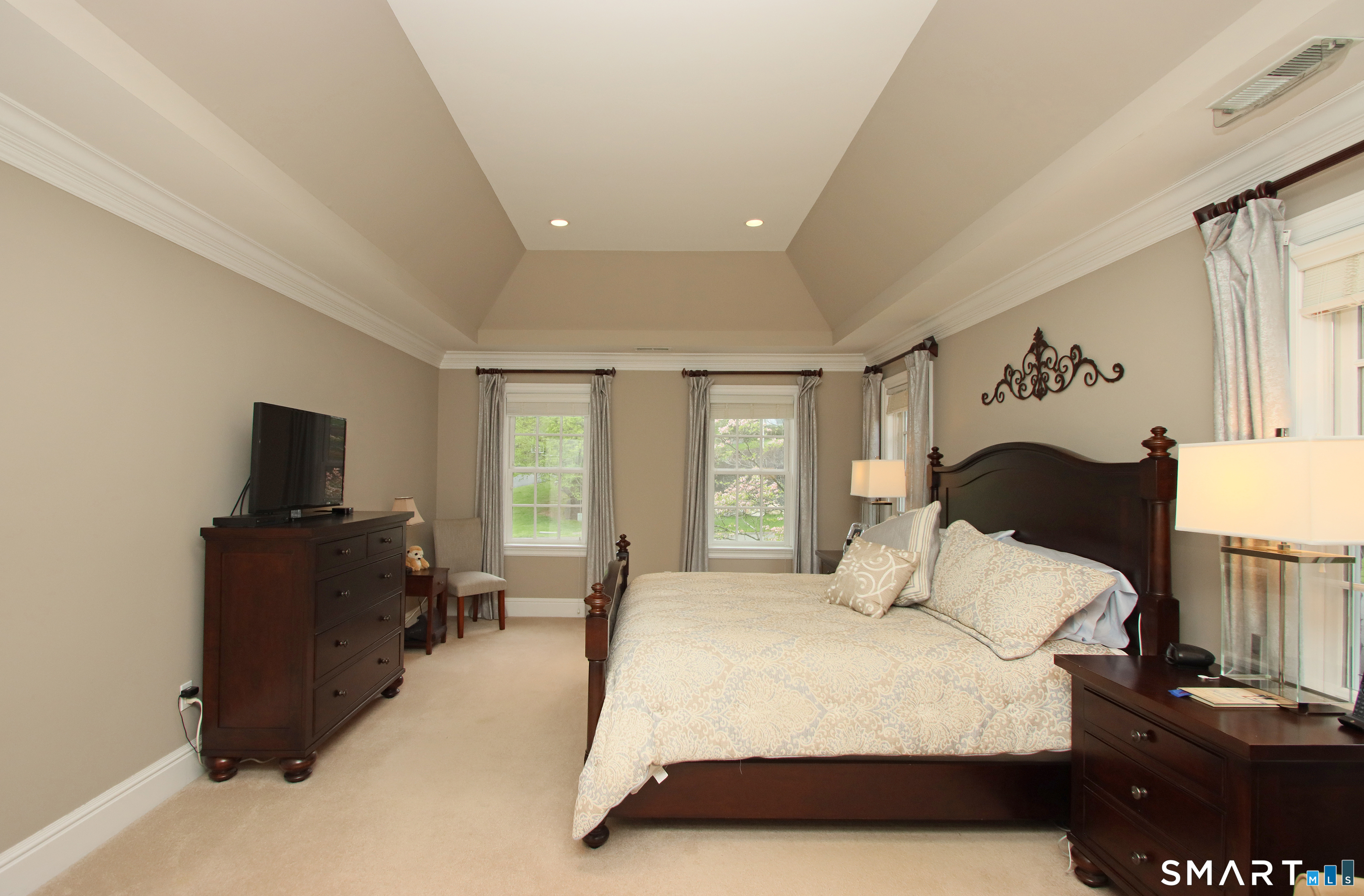 28 Quail Ridge Drive Avon, CT 06001 - Photo 29 of 40 a bedroom with a bed and a flat screen tv