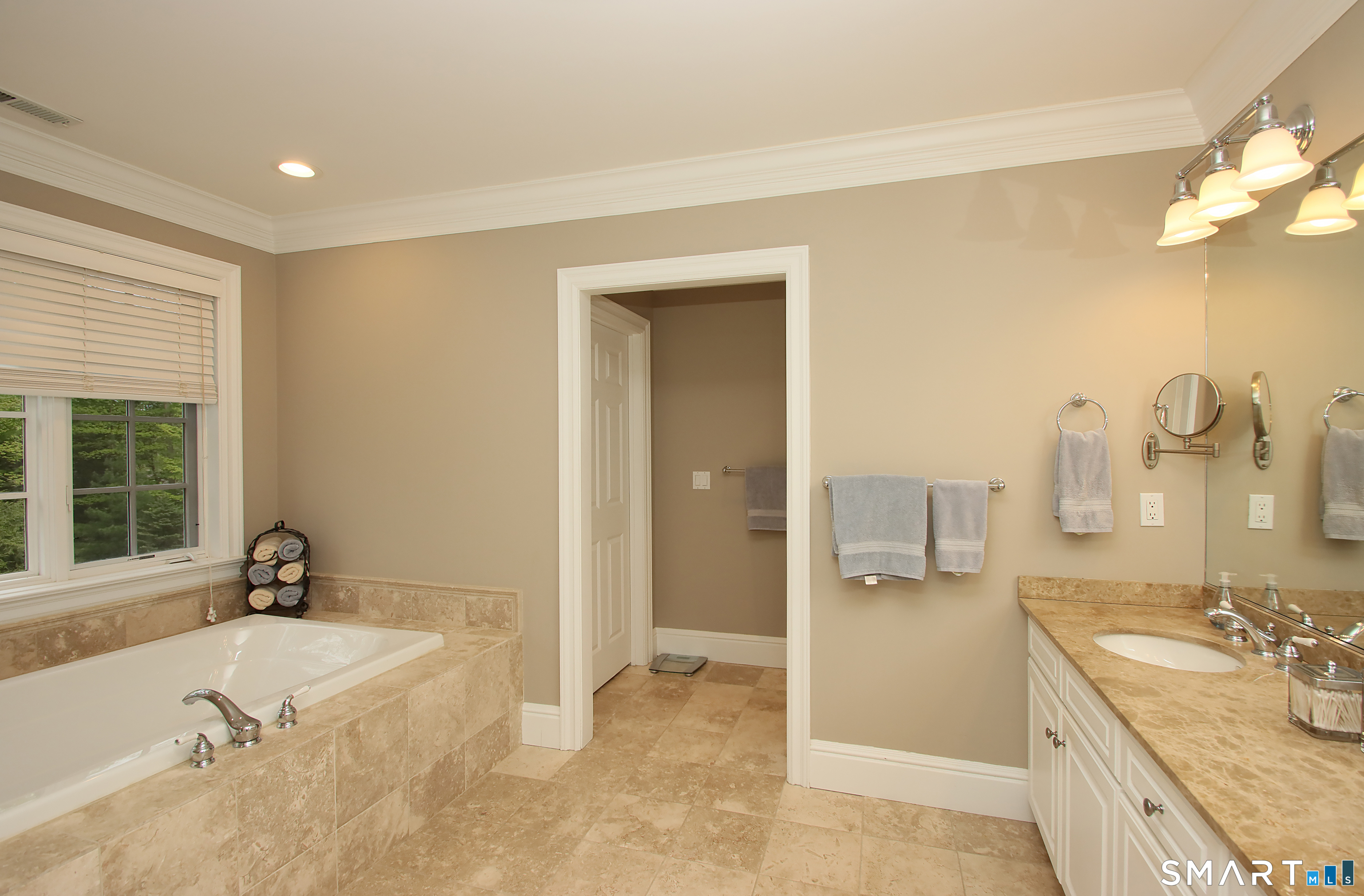 28 Quail Ridge Drive Avon, CT 06001 - Photo 31 of 40 a bathroom with a tub sink and mirror