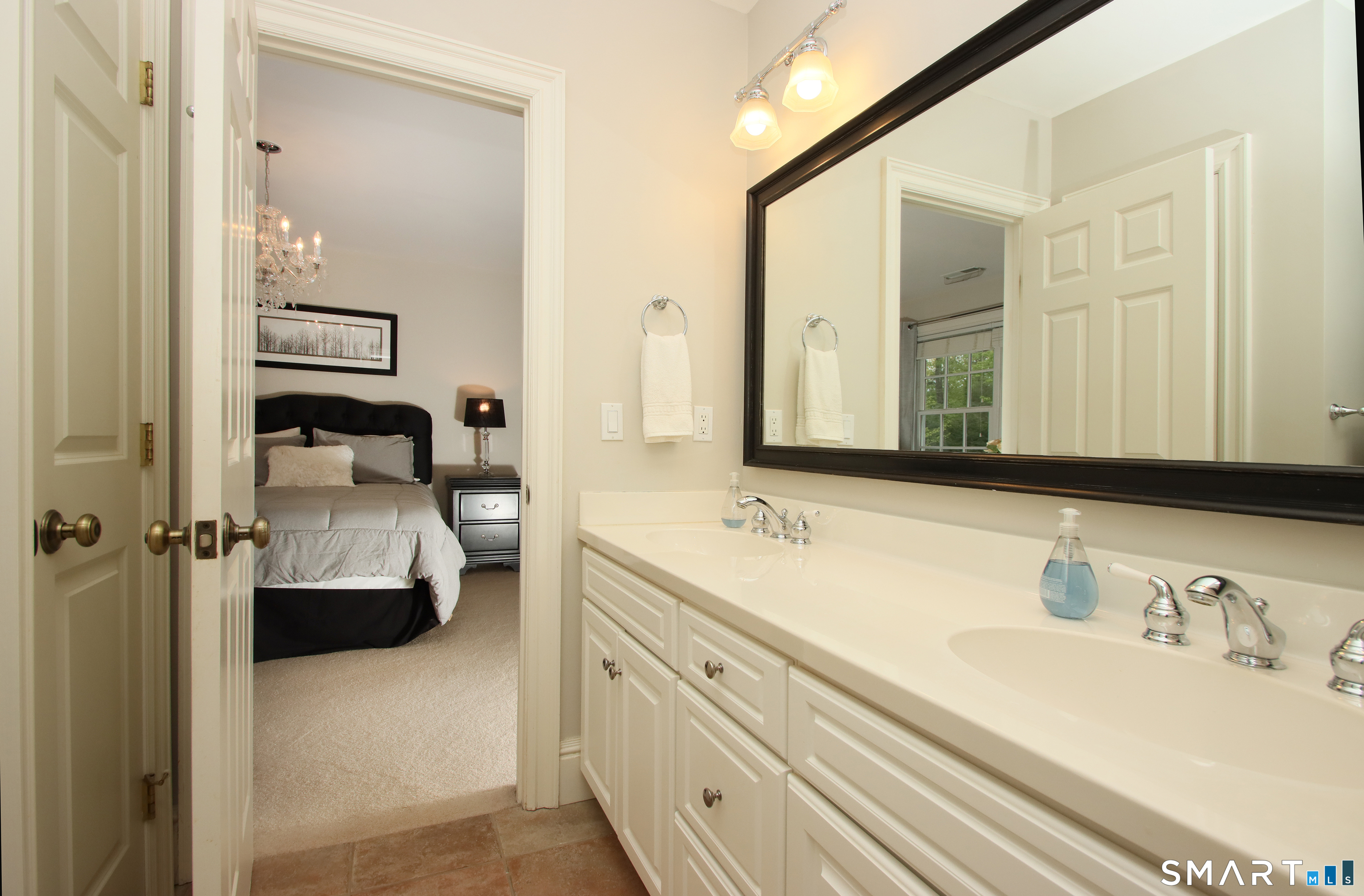 28 Quail Ridge Drive Avon, CT 06001 - Photo 36 of 40 a bathroom with a double vanity sink and mirror