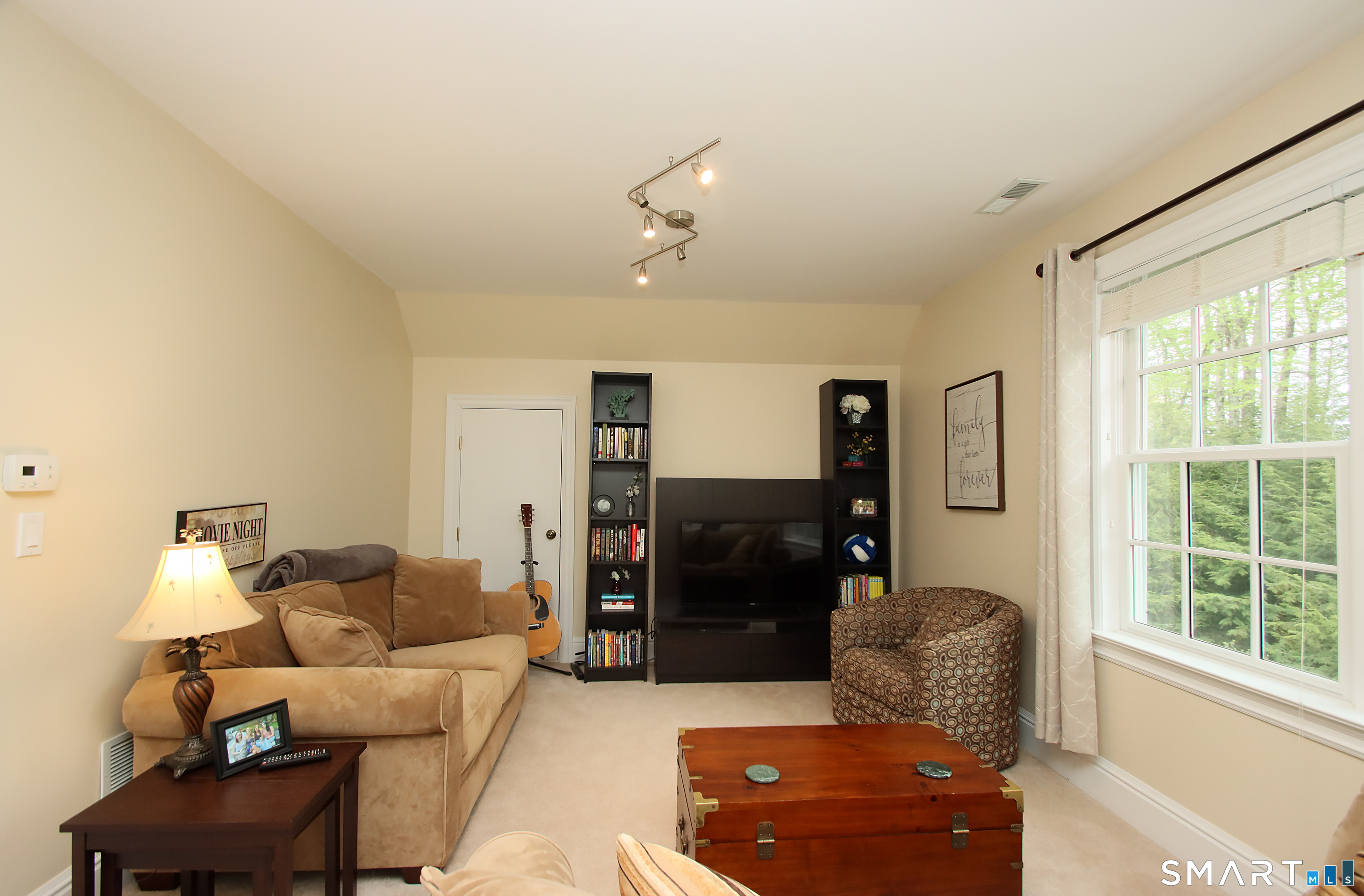 28 Quail Ridge Drive Avon, CT 06001 - Photo 37 of 40 a living room with furniture and a window