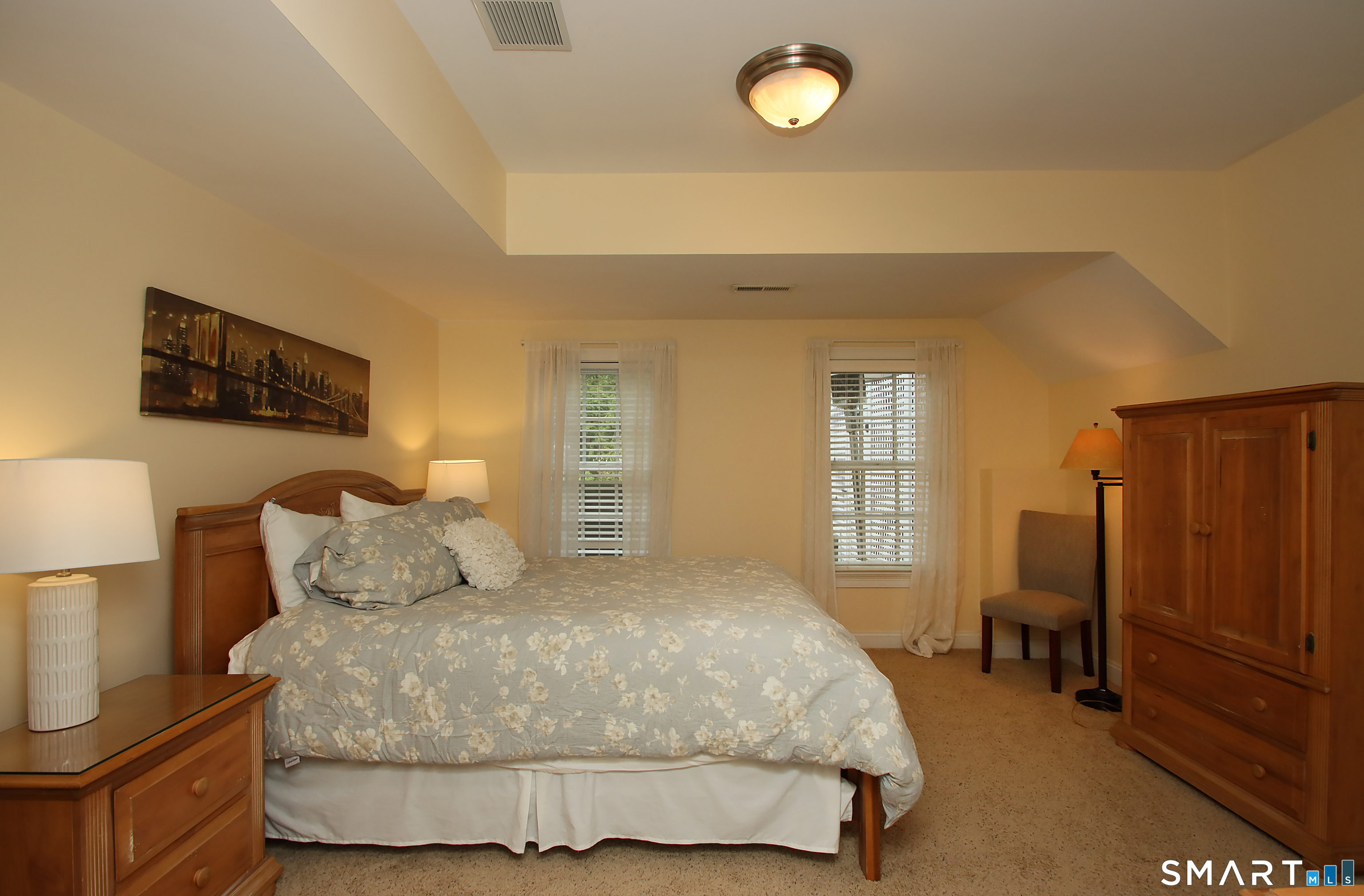 28 Quail Ridge Drive Avon, CT 06001 - Photo 40 of 40 a bedroom with a bed and wooden floor