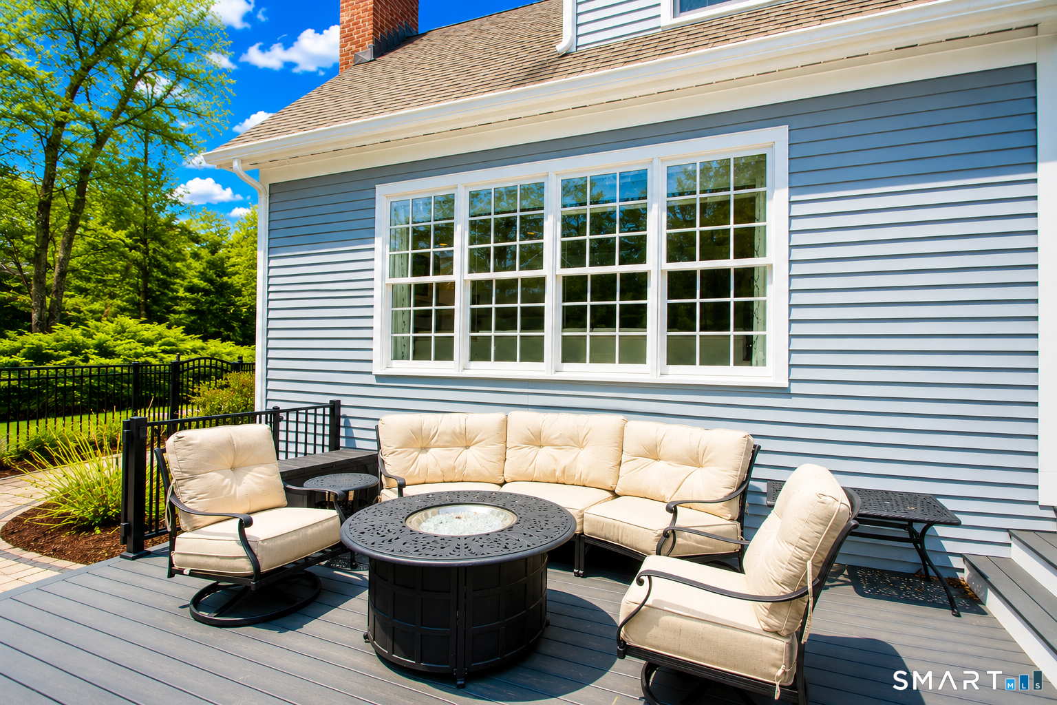 28 Quail Ridge Drive Avon, CT 06001 - Photo 9 of 40 a view of a patio with couches and a dining table with garden view