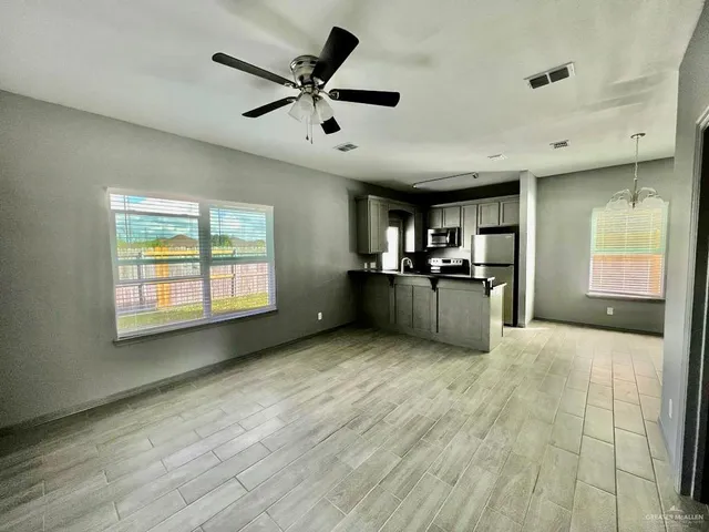 a view of a kitchen with a sink and cabinet area