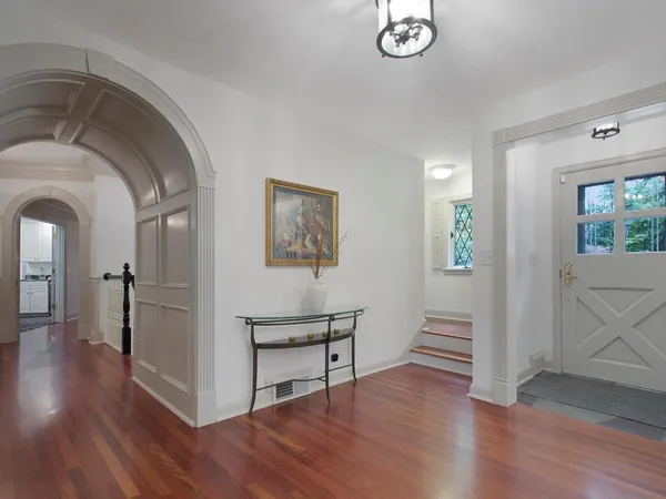 a dining room with furniture and a window