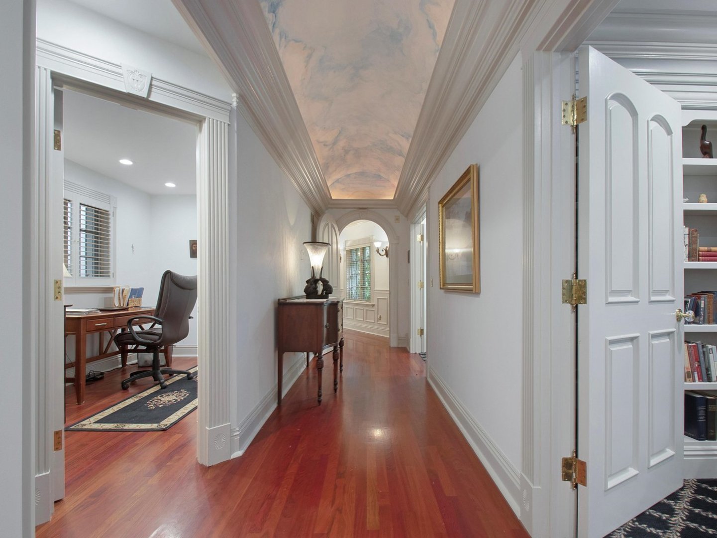 1850 North Mulford Road Rockford, IL 61107 - Photo 13 of 42 a view of a hallway and wooden floor a livingroom with furniture