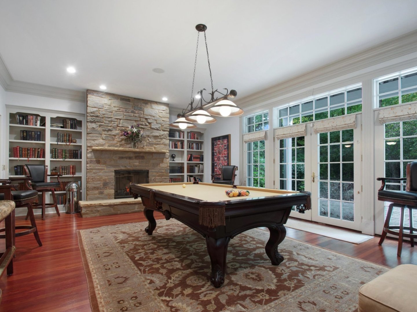 1850 North Mulford Road Rockford, IL 61107 - Photo 15 of 42 a room with fireplace wooden table and windows