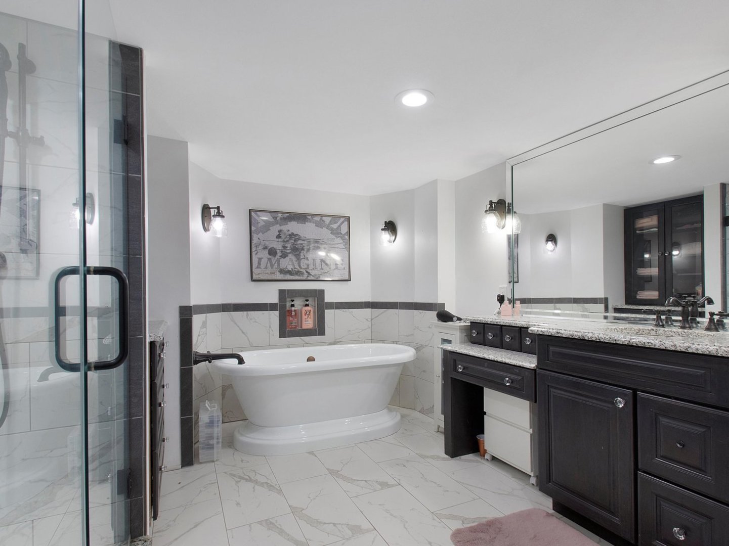 1850 North Mulford Road Rockford, IL 61107 - Photo 22 of 43 a bathroom with a sink a toilet and mirror