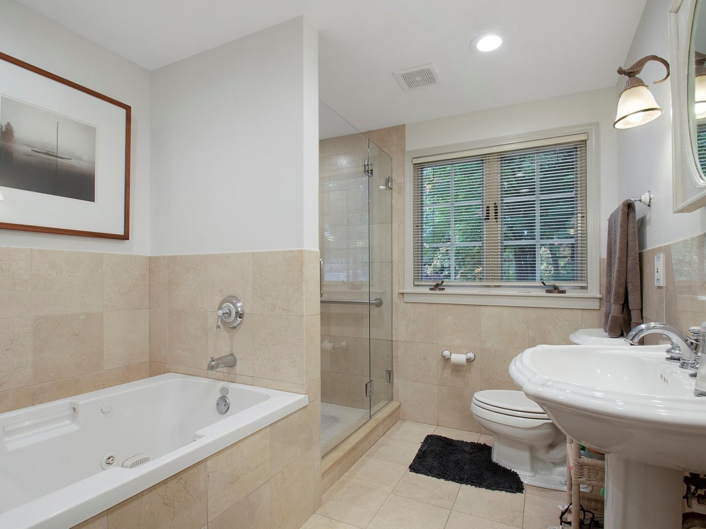 1850 North Mulford Road Rockford, IL 61107 - Photo 32 of 43 a bathroom with a sink a toilet and bathtub