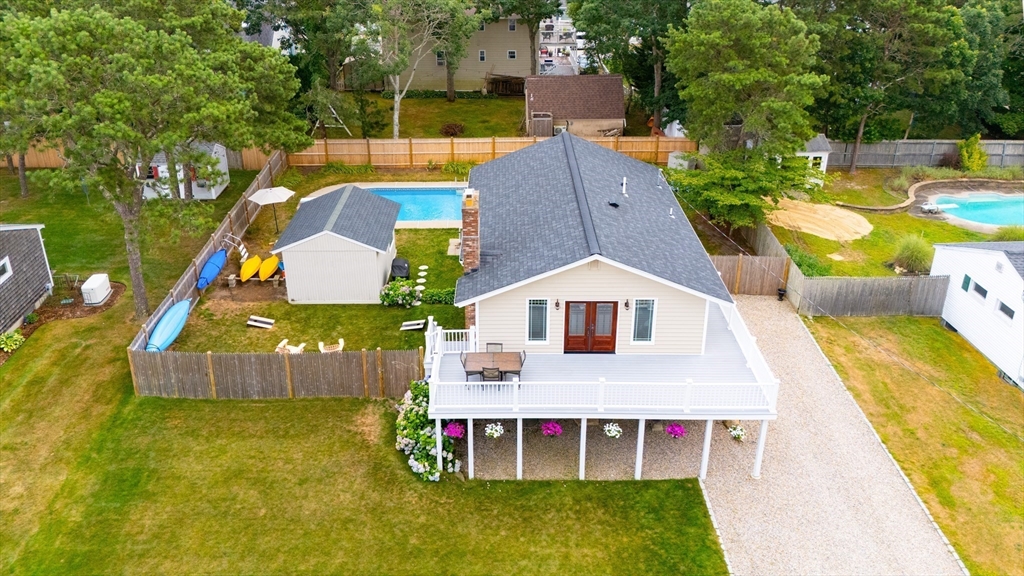 100 Madeline Road Falmouth, MA 02536 - Photo 1 of 29 an aerial view of a house with swimming pool