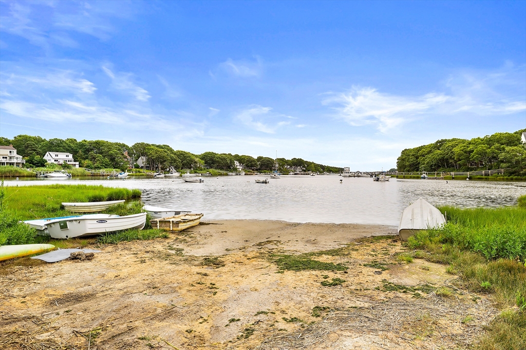 100 Madeline Road Falmouth, MA 02536 - Photo 28 of 29 a view of a lake with houses in the background
