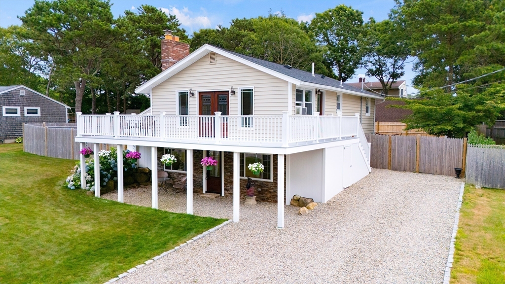100 Madeline Road Falmouth, MA 02536 - Photo 3 of 29 a view of a house with backyard and porch