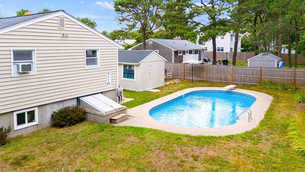 100 Madeline Road Falmouth, MA 02536 - Photo 4 of 29 a view of a house with swimming pool