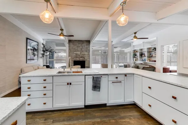 a kitchen with a stove and a refrigerator