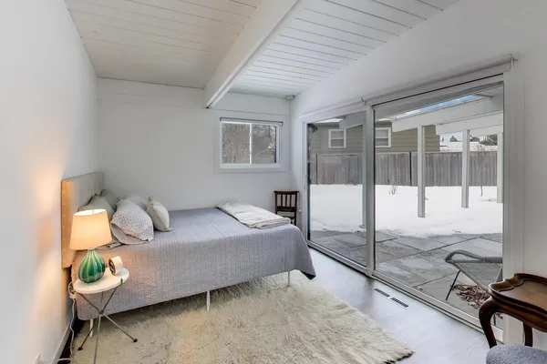 a bedroom with a bed and a desk