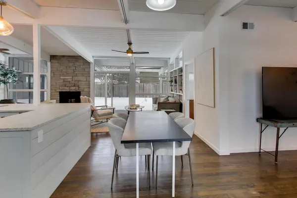 a living room with fireplace furniture and a flat screen tv