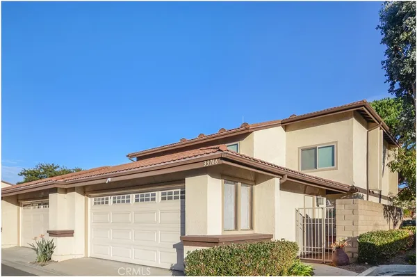 a front view of a house with garage