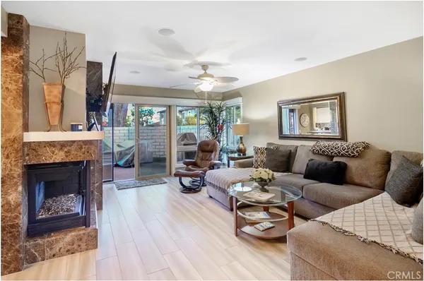 a living room with furniture and a fireplace