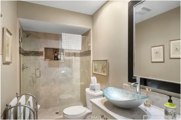 a view of staircase with furniture and a chandelier