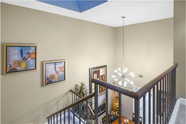 a bedroom with a bed a couch and dresser