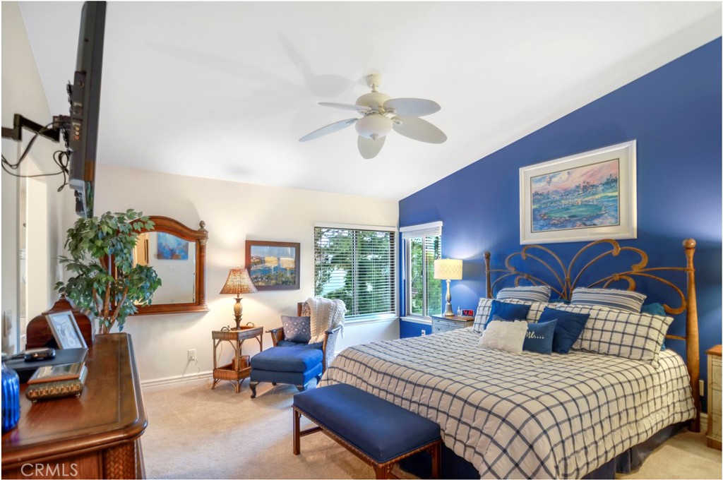 33766 Captains Lane, Unit 200 Dana Point, CA 92629 - Photo 22 of 38 a bedroom with a bed a couch and dresser