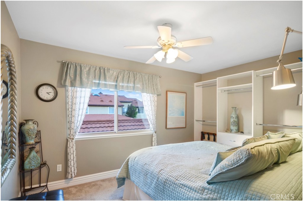 33766 Captains Lane, Unit 200 Dana Point, CA 92629 - Photo 28 of 38 a bedroom with a bed and a window