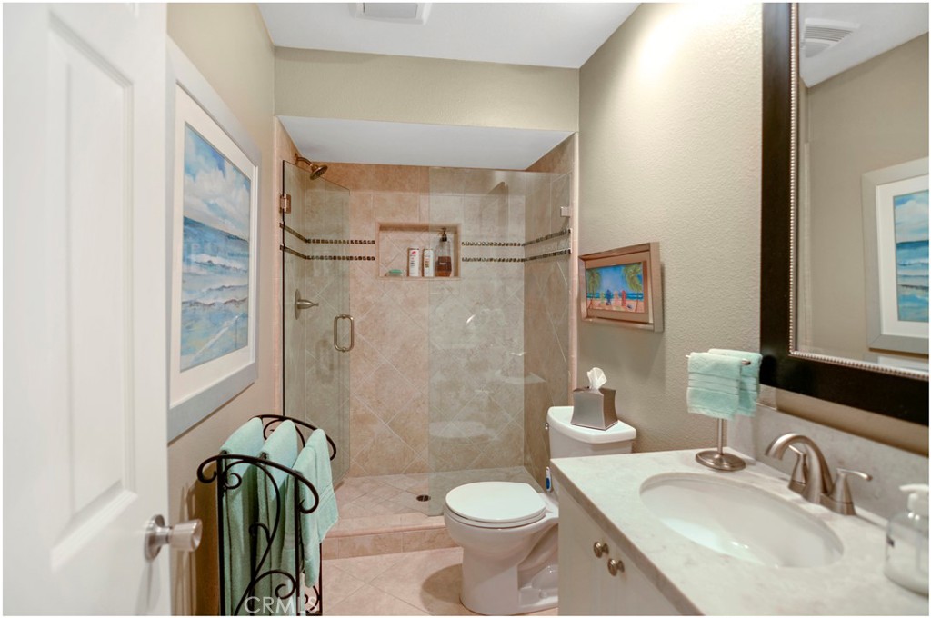 33766 Captains Lane, Unit 200 Dana Point, CA 92629 - Photo 29 of 38 a bathroom with a sink a toilet and shower
