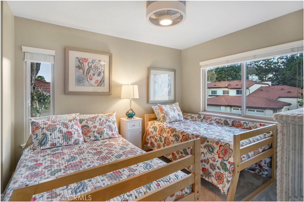 33766 Captains Lane, Unit 200 Dana Point, CA 92629 - Photo 30 of 38 a living room with furniture and a large window