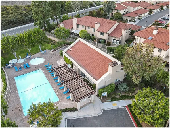 an aerial view of a house with a swimming pool