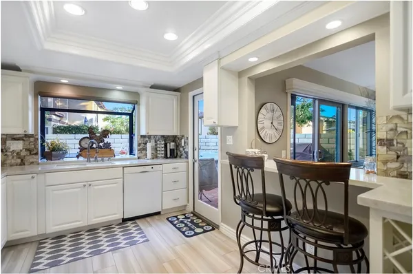 a view of kitchen with furniture and wooden floor