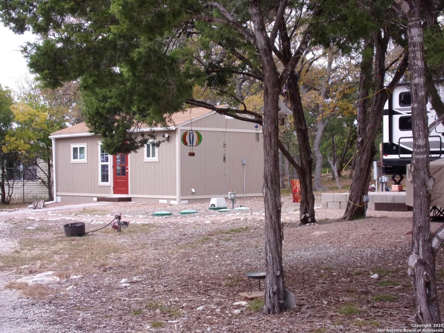 2471 Rolling River Spring Branch, TX 78070 - Photo 18 of 24 a backyard of a house with table and chairs