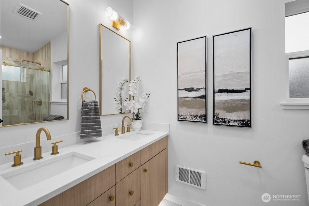 3215 22nd Avenue South Seattle, WA 98144 - Photo 16 of 28 a bathroom with a double vanity sink mirror and shower