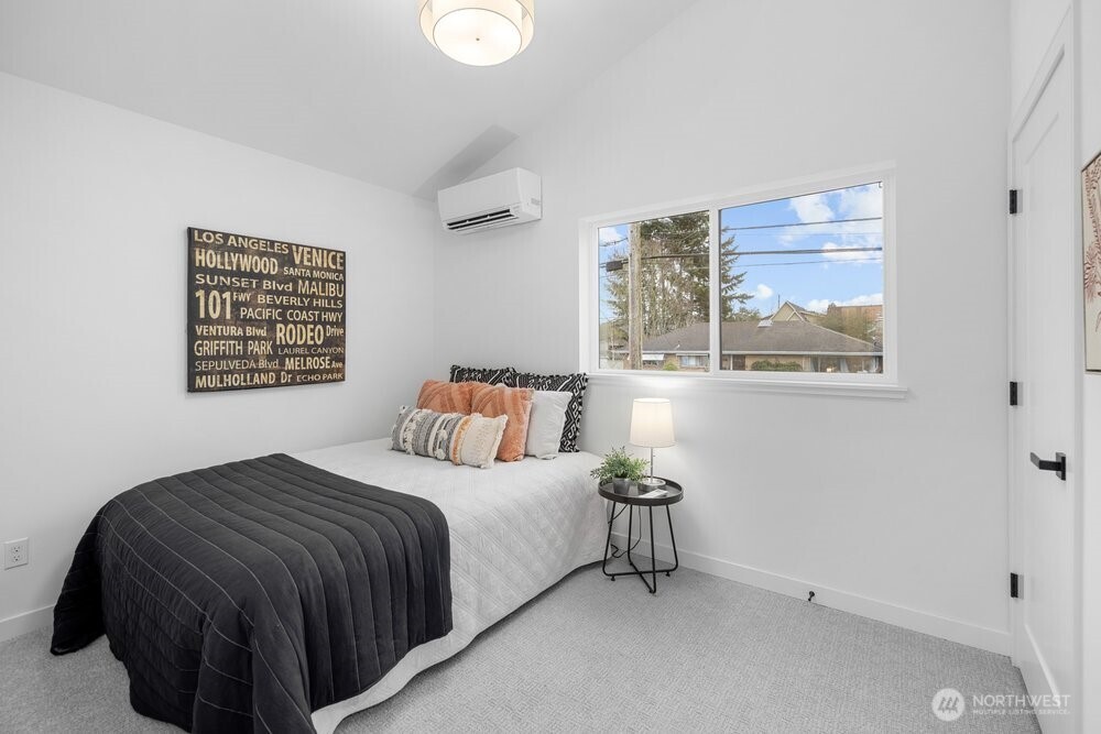 3215 22nd Avenue South Seattle, WA 98144 - Photo 20 of 28 a bedroom with a bed and a painting on the wall