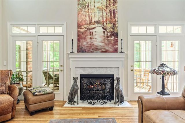 a living room with stainless steel appliances kitchen island granite countertop furniture and a kitchen view