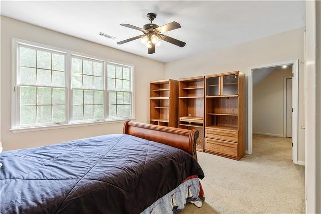 an aerial view of a house with yard and outdoor seating