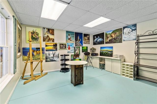 a view of house with backyard