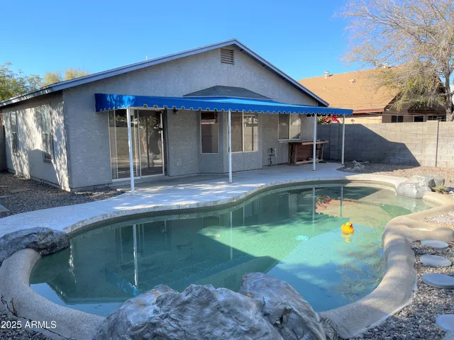 a view of a house with swimming pool