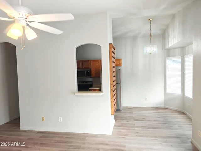 a view of a room with wooden floor and staircase