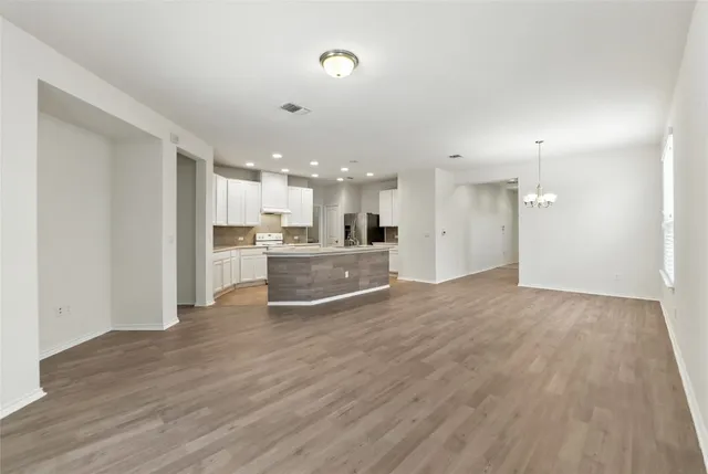 a view of kitchen with wooden floor