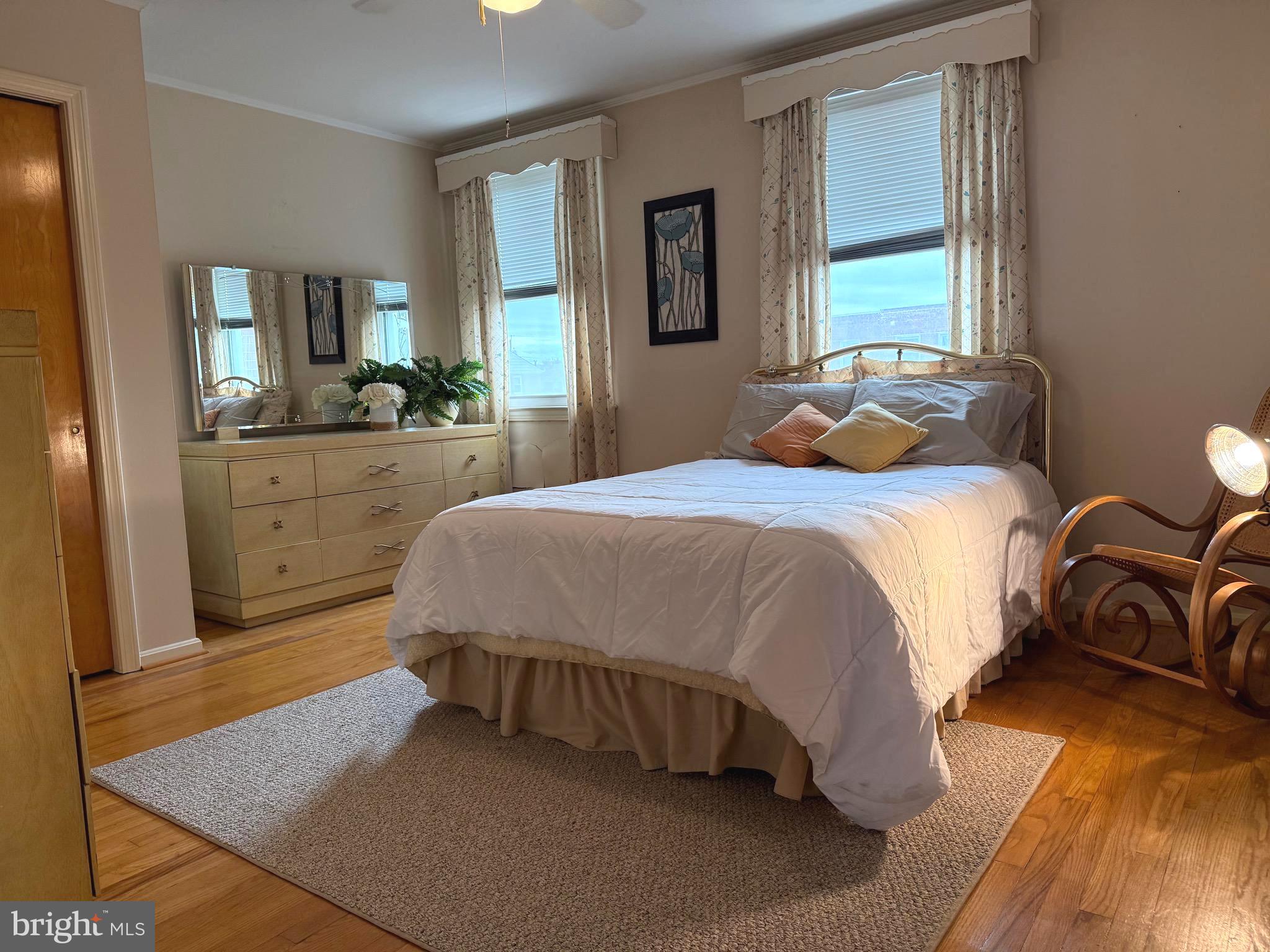 8144 Gray Haven Road Baltimore, MD 21222 - Photo 12 of 37 a bedroom with a bed and window