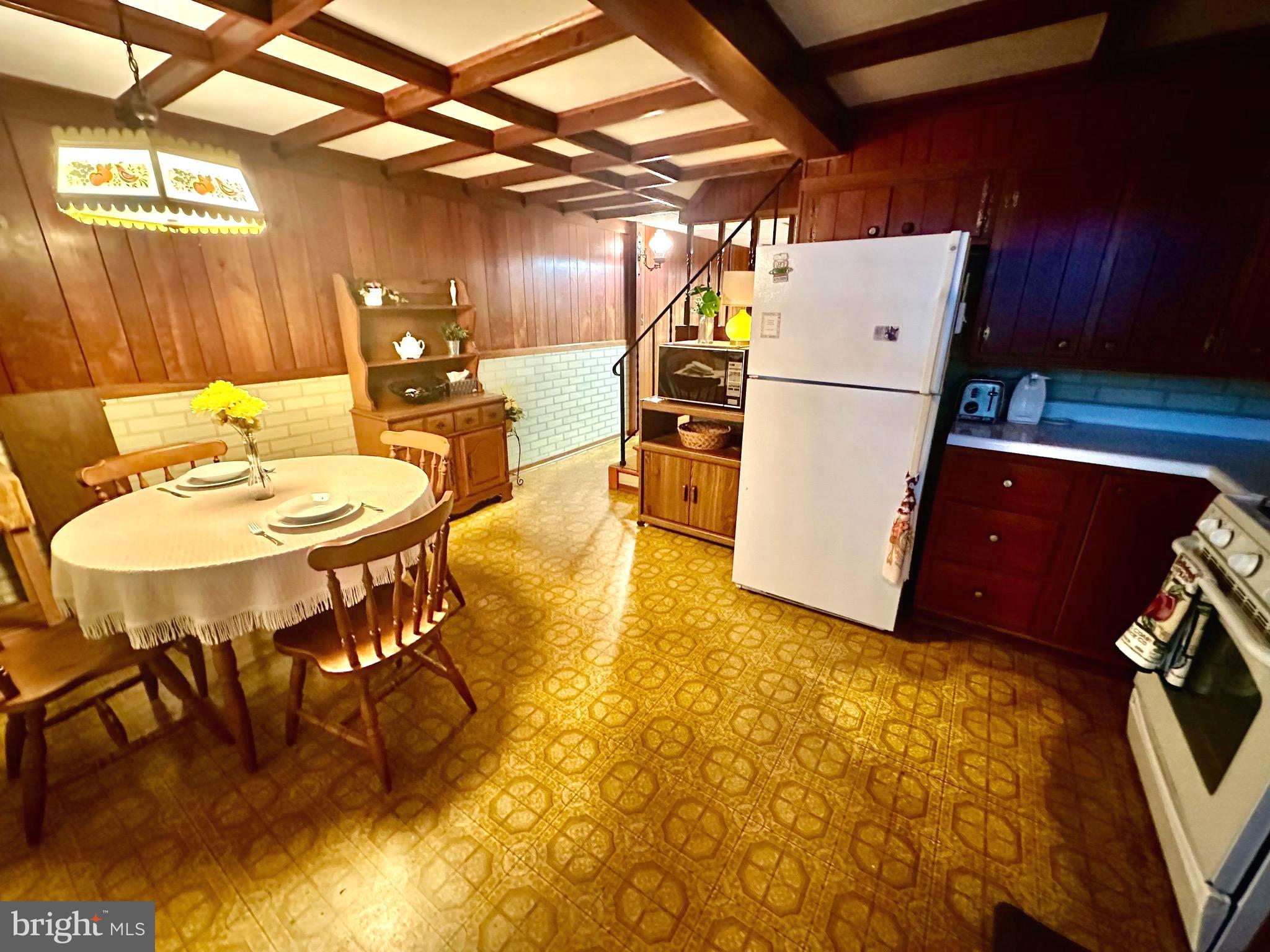 8144 Gray Haven Road Baltimore, MD 21222 - Photo 23 of 37 a view of a dining room with furniture and wooden floor
